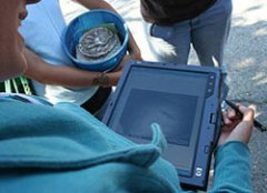 Female student holding HP tablet