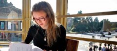 Student reading in café